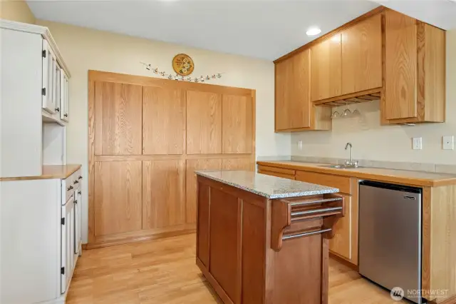 With its own living room, pool table area, workout room, craft bedroom, and generous storage, the lower level is a true extension of the home - complete with a flexible mini kitchen that makes hosting guests, multigenerational living, or casual entertaining a breeze. All this opens to a beautifully landscaped garden retreat.