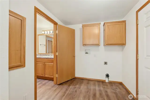 Laundry room with door outside