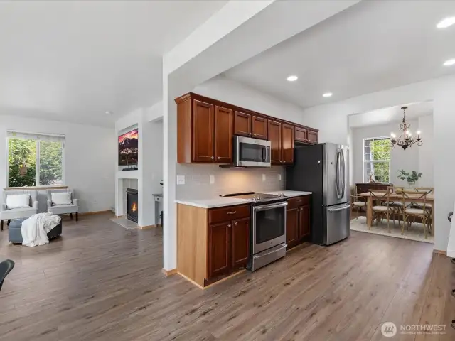 The open, spacious layout flows easily into the formal living and dining rooms, making the main level feel both inviting and connected.