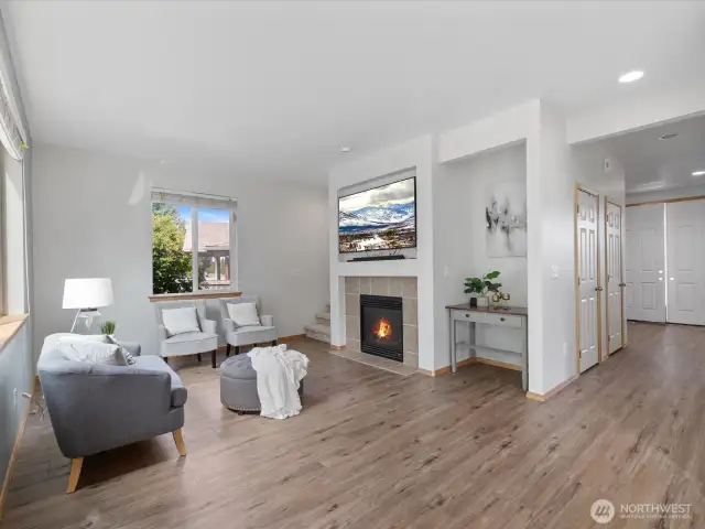 Open to the kitchen, the family room offers a comfortable retreat. Gather around the gas fireplace on chilly evenings or enjoy the natural light streaming through oversized windows during the day.