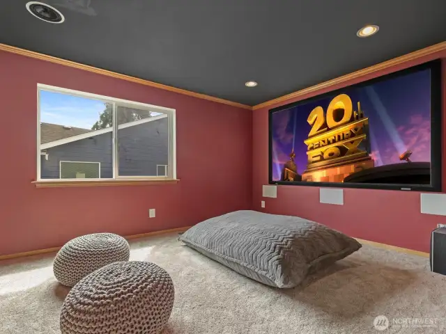 The crown jewel of this home is the professionally designed theatre room. Outfitted with a built-in projector, screen, and certified 7.2 THX Dolby surround sound system, it delivers a true cinematic experience without leaving home.