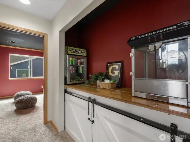 "Concession stand" - with sliding barn door enclosure, you can make this extra storage space!