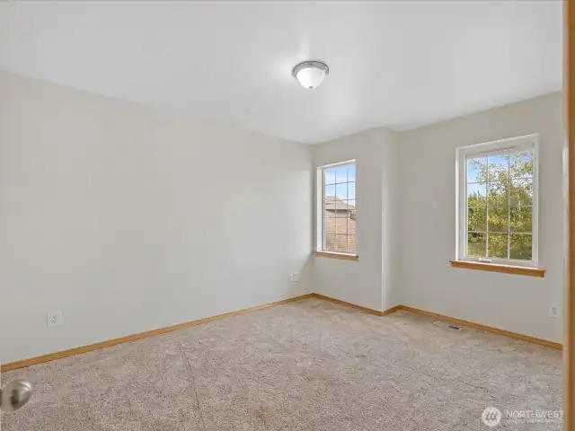 Two more oversized bedrooms upstairs provide plenty of room for family, guests, or home offices.