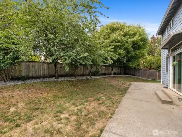 Step outside to a fully fenced backyard with refreshed landscaping, offering space for pets, play, or gardening.