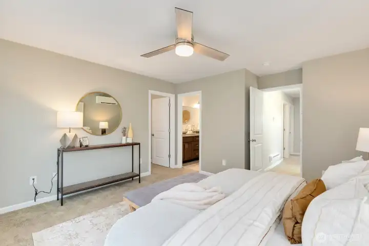 View looking out to hall, into ensuite and large walk-in closet.