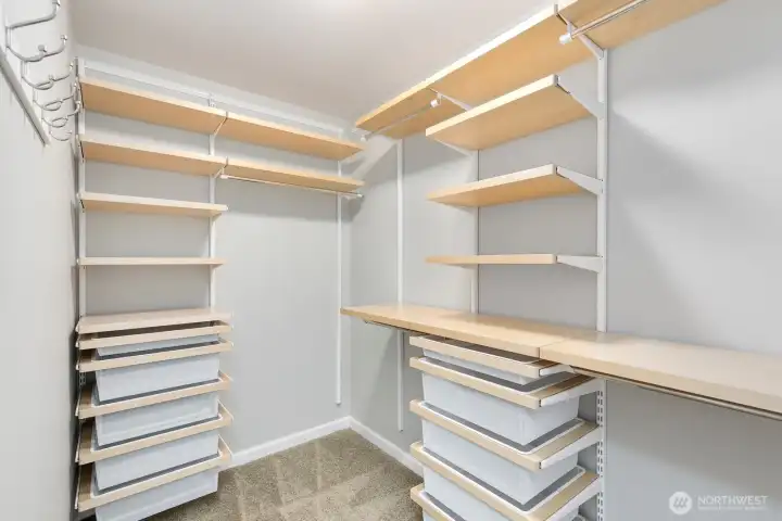 Fantastic walk-in closet with organization system!
