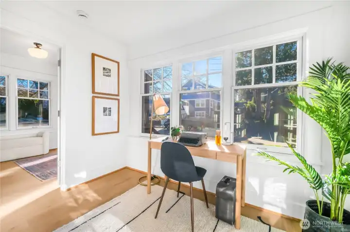 Front "office" flex space or use as an extension to the front bedroom. South facing with great light, walls of windows and can be fully closed off by french doors.