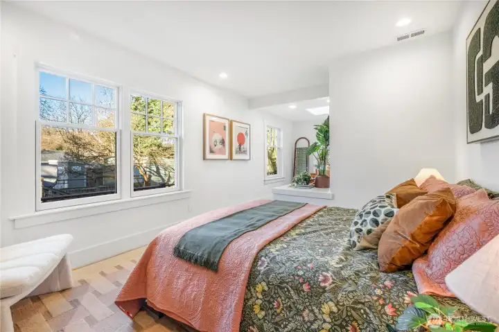 Second main level bedroom, West facing exposure plus sitting/dressing area.