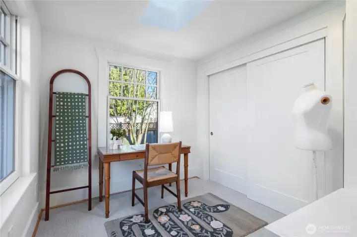 Dressing/sitting area and double closet off of main level bedroom.