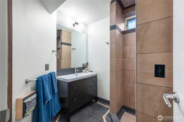 Lower level 3/4 bathroom with large walk in shower.