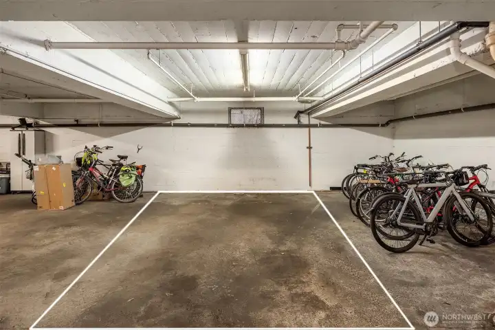 Unit #302 has one of just eight secure garage parking spaces - a rare and valuable find in Lower Queen Anne!
