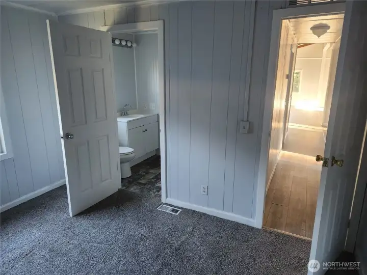 Bedroom #2 looking at hallway and shared bathroom with Utility Room