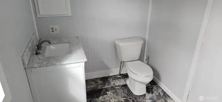 Master Bathroom highlighting spacious room around sink/toilet