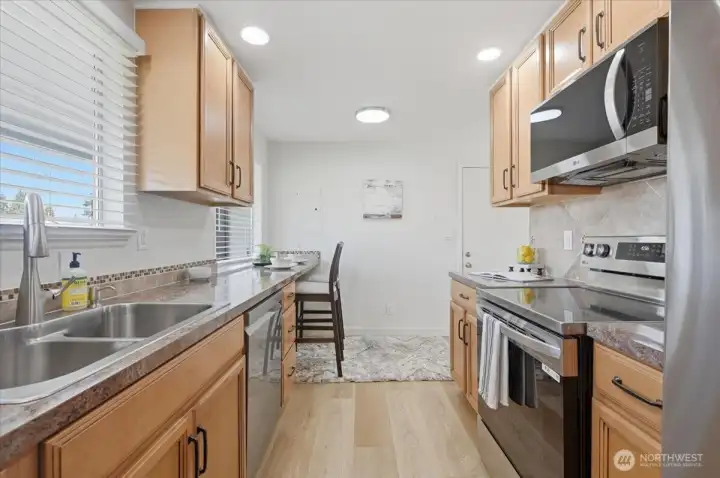Remodeled kitchen with stainless appliances and eating nook, New interior paint throughout.