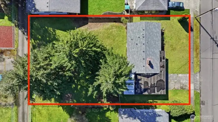 Large level backyard is fully fenced and offers alley access in back.