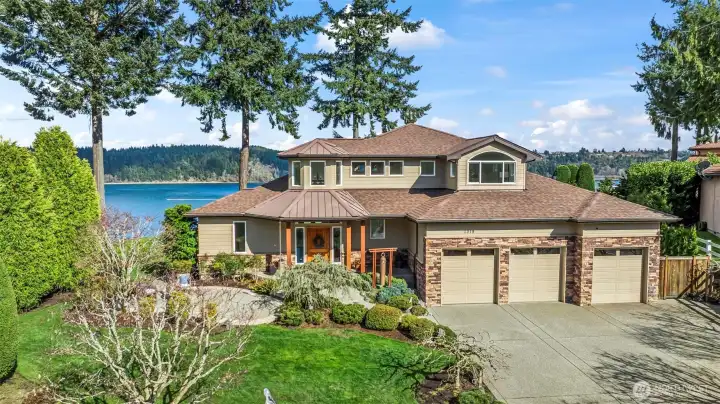 This single owner custom home is perched on the bluff with 100 ft of shoreline.  The last home on a private road gives it a sense of privacy and seclusion.  It has been meticulously maintained both inside and throughout the manicured grounds.