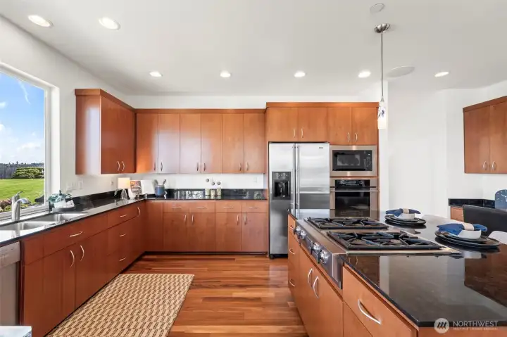 The kitchen is just the right size with plenty of cabinets, office nook, and huge walk in pantry