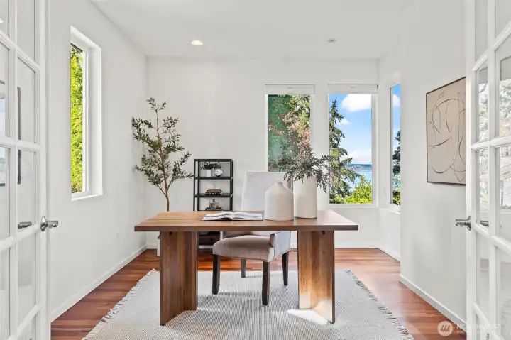 This delightful office is just inside the entry with french doors and a great view of its own