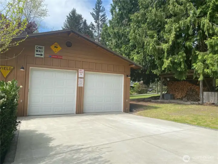 Shop - heated with four bays and mechanic's pit. Convenient cut wood shed for cozy woodburning stove in Living Room. Shop - heated with four bays and mechanic's pit. Convenient cut wood shed for cozy woodburning stove in Living Room.