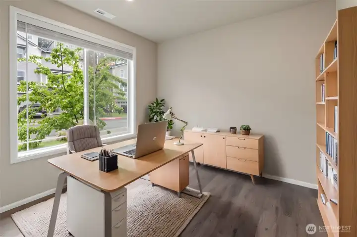 Virtually Staged mail level office with french doors.