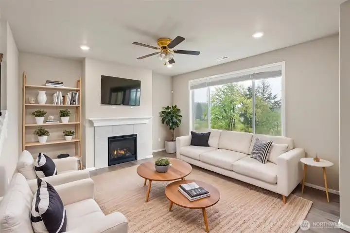 Virtually Staged Living room with natural gas fireplace.
