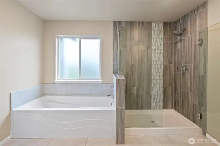 Primary bath with soaking tub and full size shower.