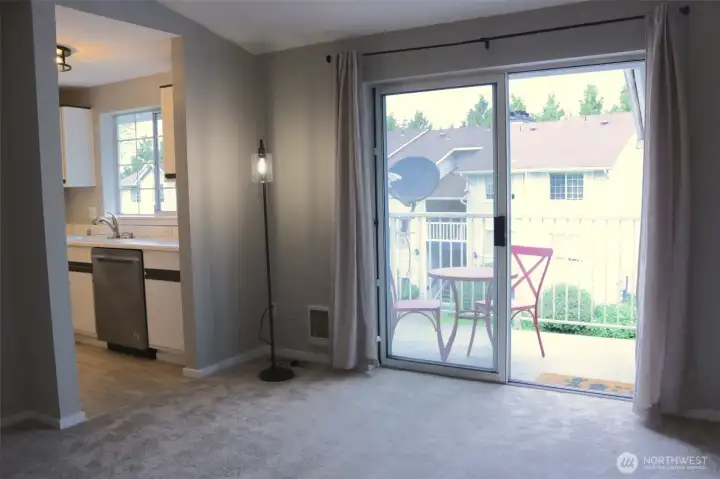 looking into the kitchen and deck from living room
