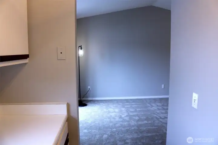 looking into the living room from the back wall of kitchen