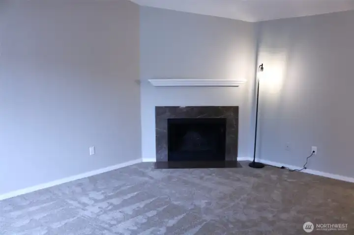 living room wood fireplace, vaulted ceiling