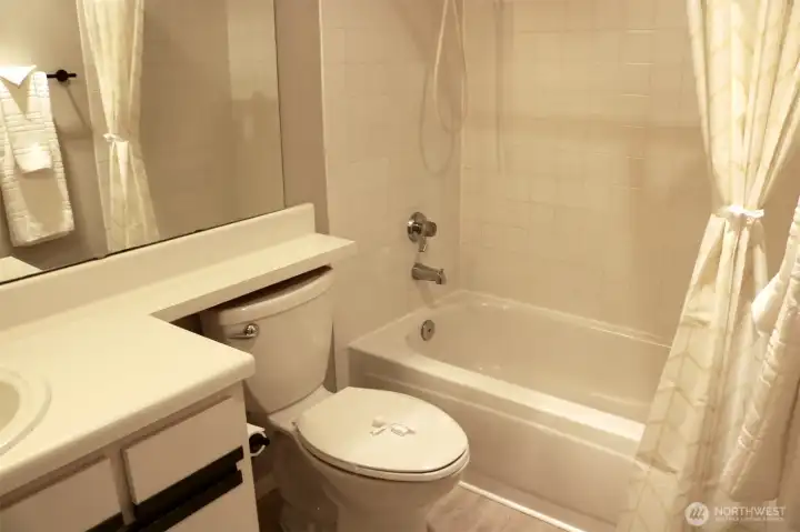 full bathroom, with new vinyl plank flooring