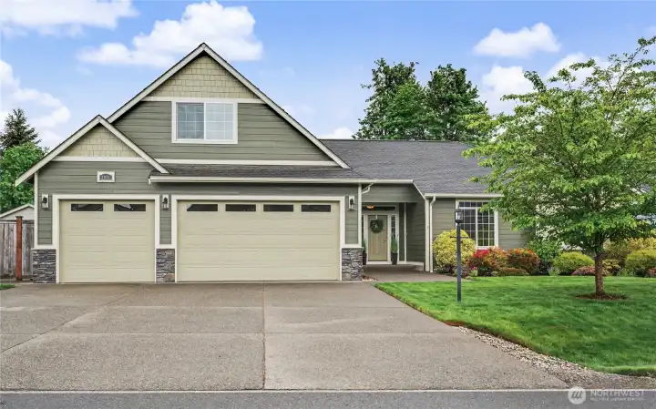 Front view of home, talk about curb appeal! LOVE this development, the wide streets, the 3-car garage and widened drive for you and your guests. Bonus room above the garage is a plus!
