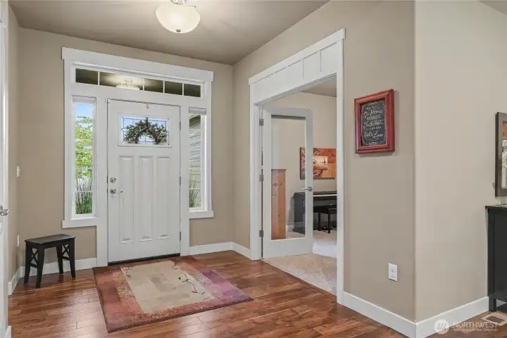 As you enter this amazing one-owner home, you will find GORGEOUS hardwoods throughout, and so many upgrades and touches like the extra molding, rounded corners, etc. On your left is your office/additional bedroom with French doors. An elegant place to work from home!