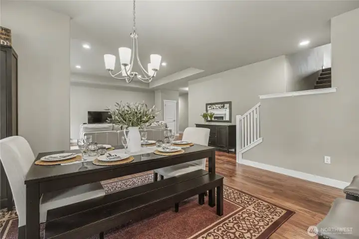 View of your dining area from the kitchen, stairs to the right lead to your bonus room over the garage.