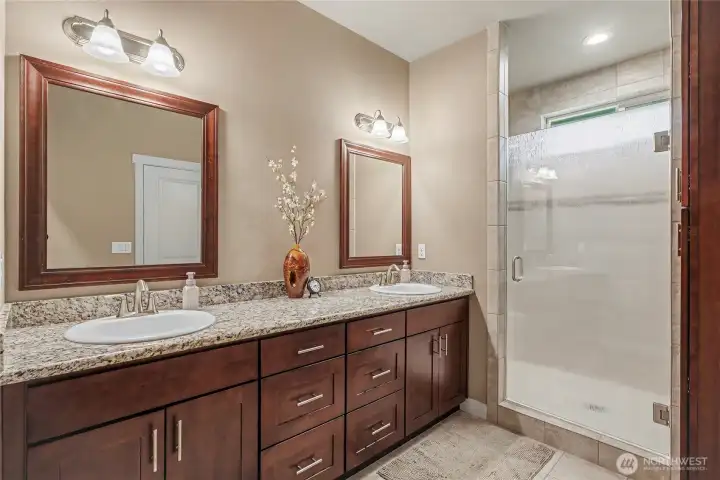 Primary ensuite bath, true 5-piece with granite, double-vanities and delicious walk-in shower.