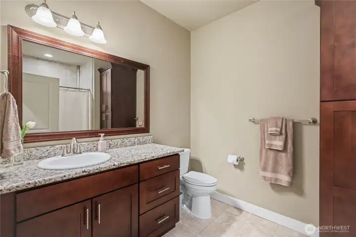 Kids/guest full bath, granite continues and I love all the dark cabinetry and mirrors.