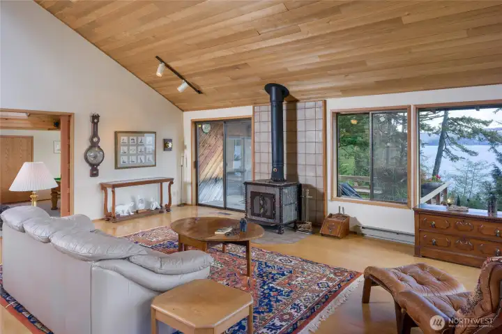 Another view of the Great Room with slider to the deck left of the wood stove.