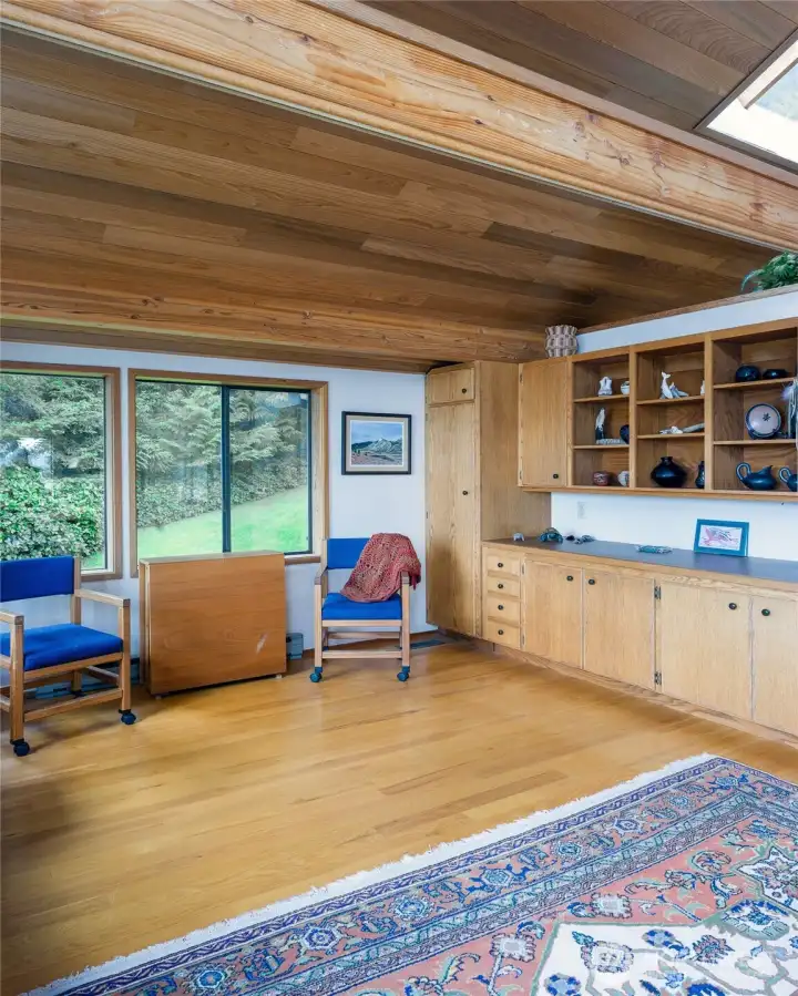 Around the corner from the kitchen is one of the flexible areas with lots of built-ins.  Just out of sight to the left is a built-in desk top.