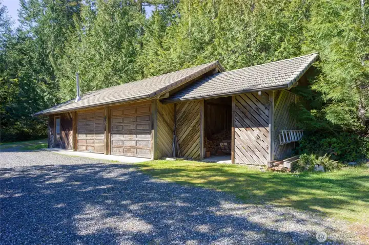 Starting from the left---workshop, 2 car garage, wood storage carport.