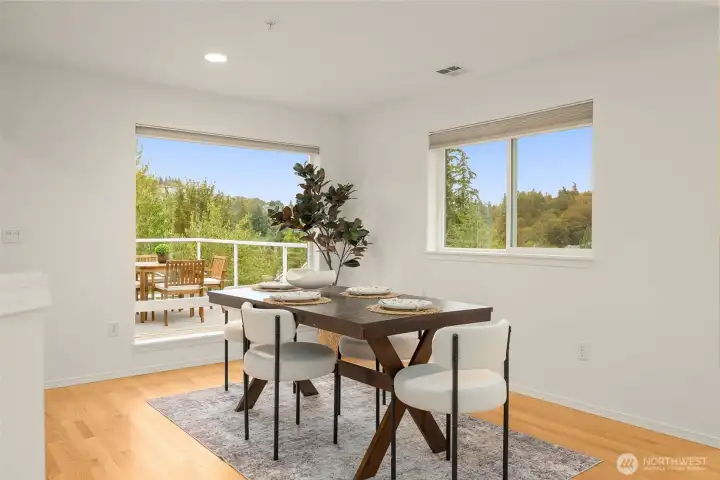 Living room opens to a dining area adjacent to a large deck Living room opens to a dining area adjacent to a large deck