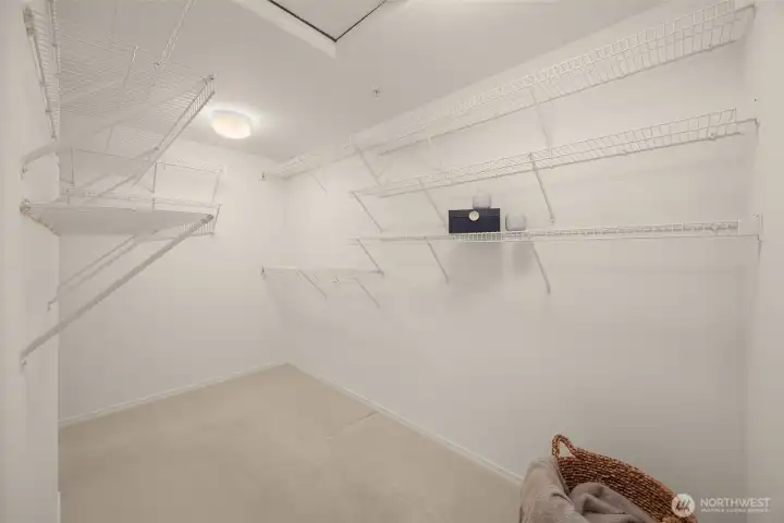 Plenty of storage space in this primary suite closet Plenty of storage space in this primary suite closet