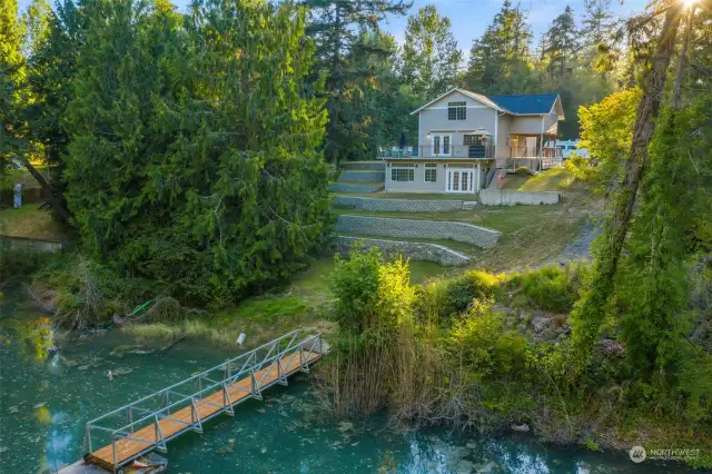 Enjoy all the privacy this property has to offer w/ 2 acres extending across water.