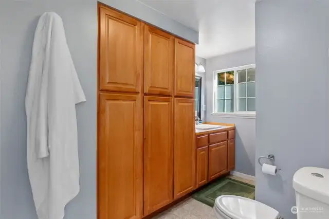 Primary bath features plenty of cabinet space.