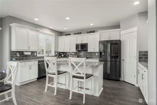 Spacious kitchen with tons of cabinetry and countertop space.