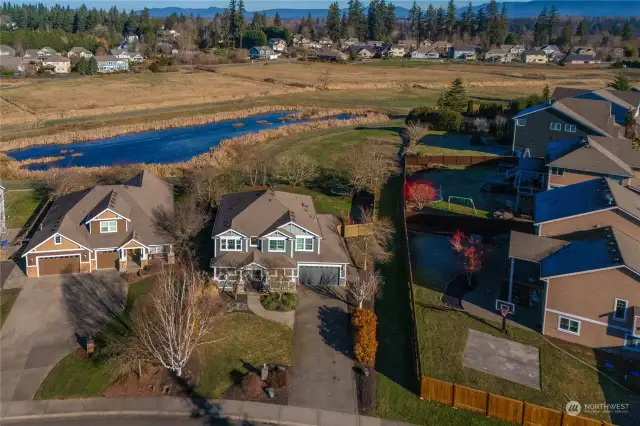 Private backyard overlooking pasture and pond.