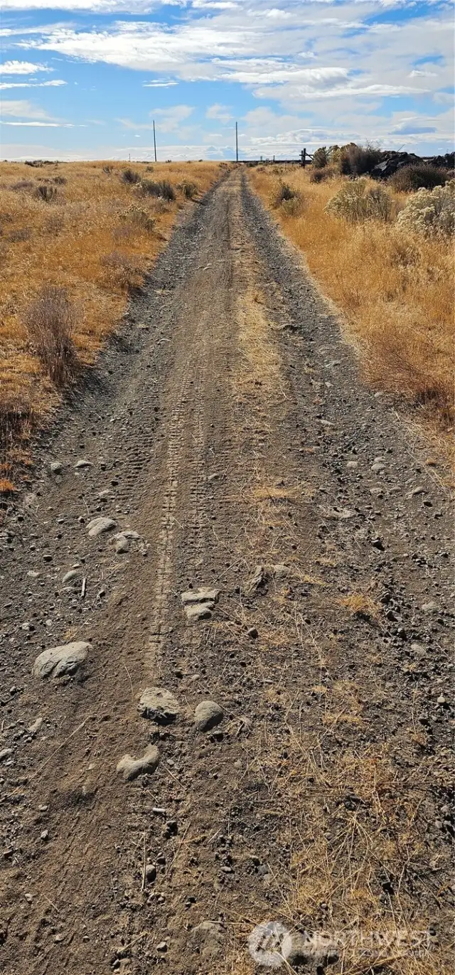Road along west boundary line of property