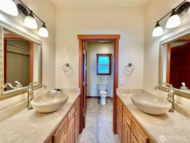 The main floor primary bedroom's ensuite complete with shower.