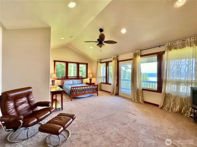 The upper primary bedroom has a deck, large walk-in closet, fireplace & full ensuite with jetted tub.