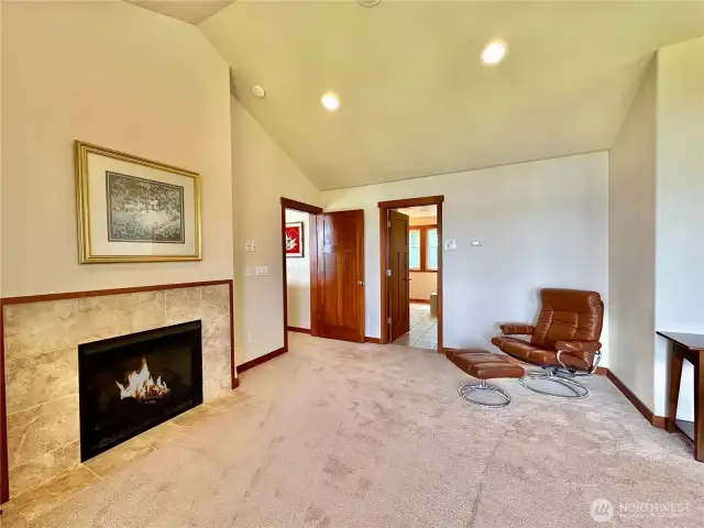 The upper primary bedroom has a deck, large walk-in closet, fireplace & full ensuite with jetted tub.