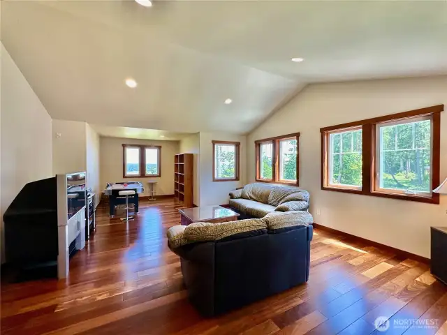A separate suite/4th bedroom with a large living space, sleeping quarters and ¾ bathroom.