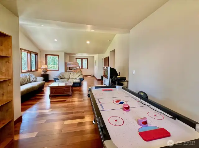 A separate suite/4th bedroom with a large living space, sleeping quarters and ¾ bathroom.
